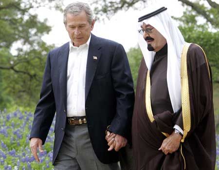 Former-US President George Bush and King for Life of Saudi Arabia, Abdullah bin Abdulaziz al Saud:"The loving parents of Al Qaeda." From the 1980's to present day, the US and Saudi Arabia have funded, armed, and directed Al Qaeda while performing propaganda campaigns to bend public perception regarding the terrorist organization - portraying them as heroes, then villains, and back again. The "War on Terror" is a fraud.