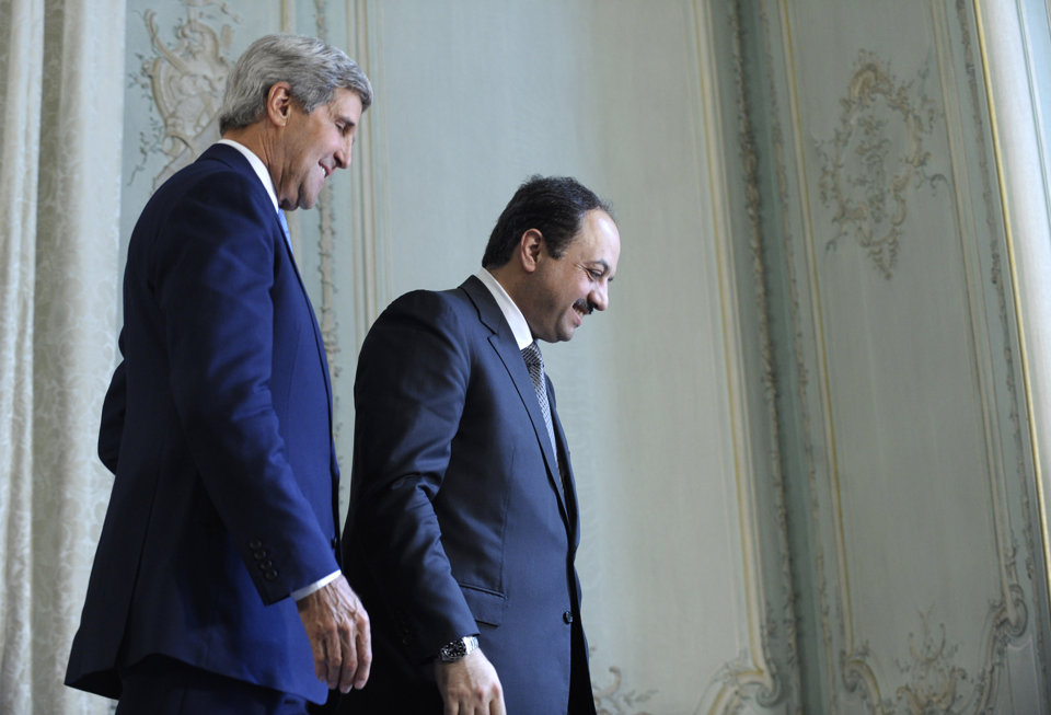 US Secretary of State John Kerry walks off the stage with Qatar Foreign Minister Khalid Al Attiya following a joint news conference at the US Embassy in Paris, Sunday September 8, 2013. (AP photo/Susan Walsh, Pool)