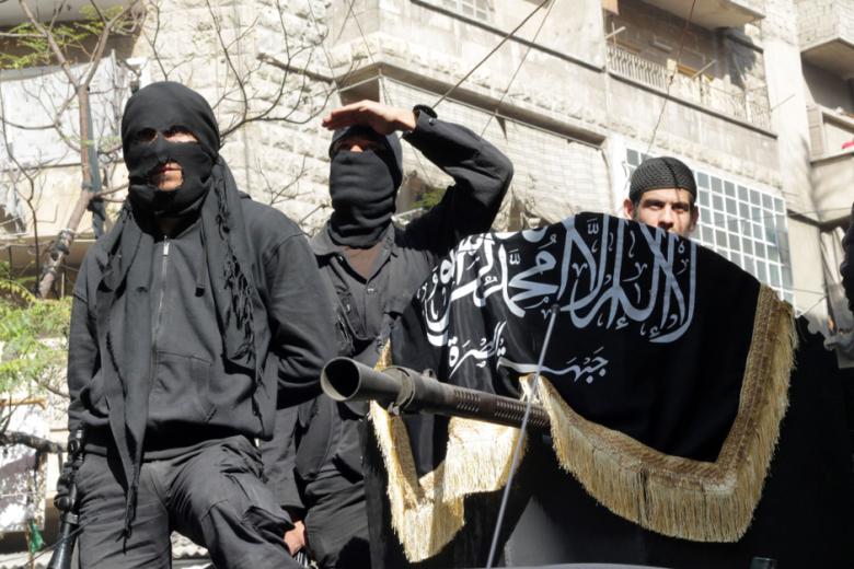 Members of jihadist group Al-Nusra Front take part in a parade calling for the establishment of an Islamic state in Syria, at the Bustan al-Qasr neighborhood of Aleppo, on October 25, 2013. (Photo: AFP - Karam al-Masri)