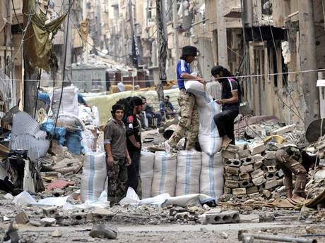 Fighters from Jabhat al-Nusra prepare barricades in eastern Syria (Reuters)