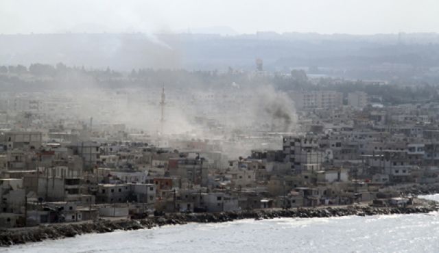 Smoke rises in the city of Latakia, August 14, 2011. Photo by Reuters