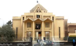 Armenian Church of the Martyrs in Raqqa. Under rebel control, it was turned into a mosque and proselytism center, flying the black flag of Al-Qaeda (ISIS)