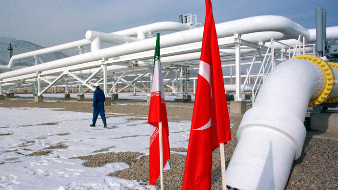 A worker walks past the pumping station on the border between Iran and Turkey (Reuters)