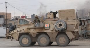 brown battle tank on brown utility truck